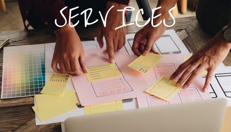Table with hands creating contacts with post it notes