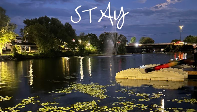 image of waterfront downtown at night with docks